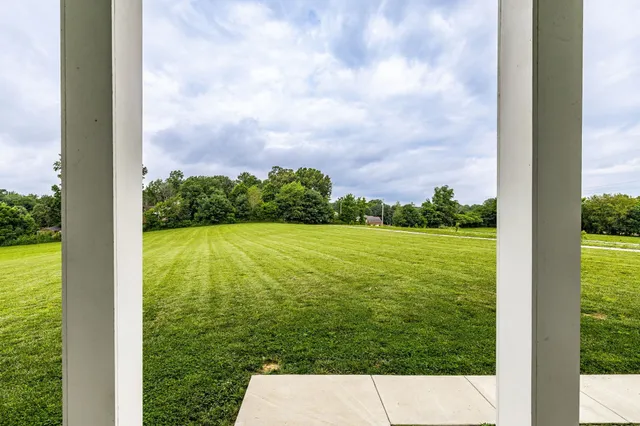 a view of a golf course with a lake view