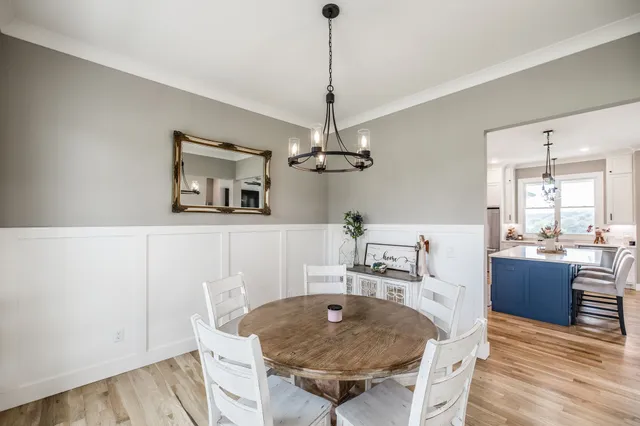 a kitchen with stainless steel appliances white cabinets and a stove