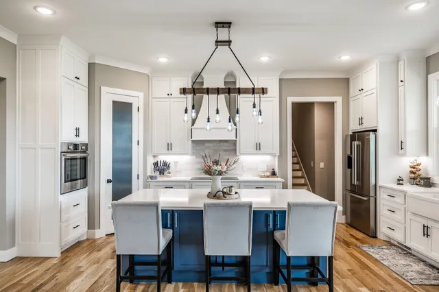 a bedroom with a large bed and a flat screen tv