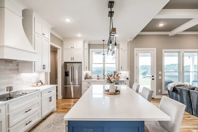 a bathroom with a bathtub a sink a mirror and a shower
