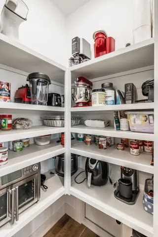 a bathroom with granite countertop a sink and a mirror