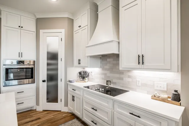 a view of workspace with wooden floor and windows