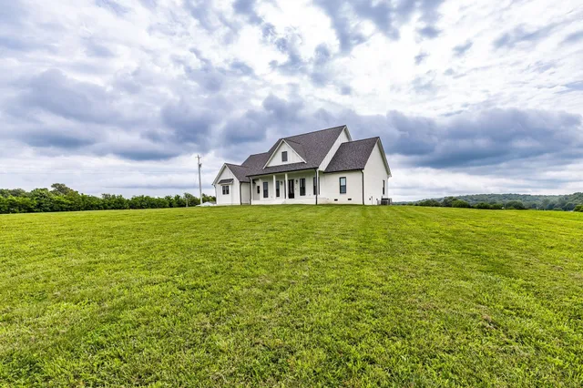 a backyard of a house with lots of green space