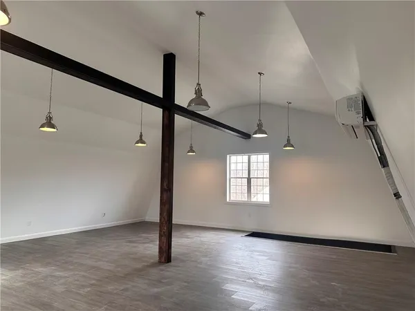 a view of a windows and chandelier in an empty room