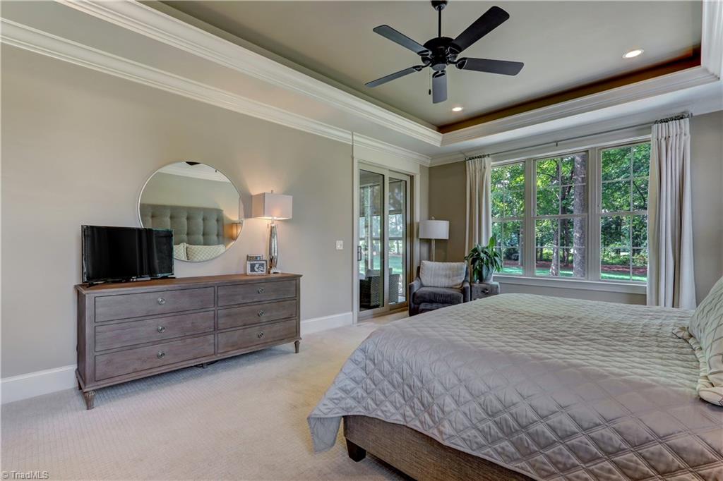6865 Matzinger Court Oak Ridge, NC 27310 - Photo 12 of 28 Another view of the Master Bedroom showing the door to the screened porch.