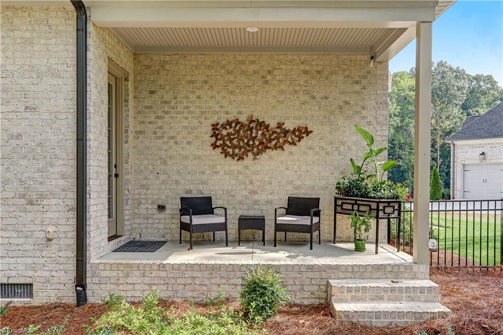 6865 Matzinger Court Oak Ridge, NC 27310 - Photo 16 of 28 A view of the private patio for the Office / Bedroom. Bead board ceiling detail and recessed lighting.