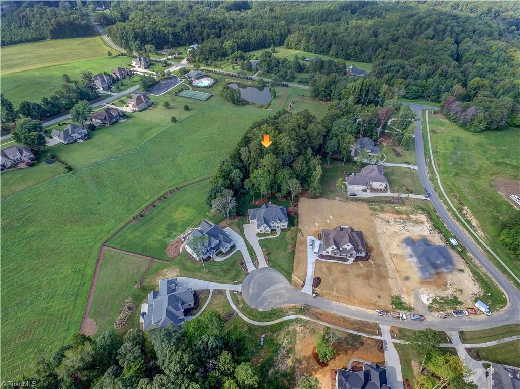 6865 Matzinger Court Oak Ridge, NC 27310 - Photo 27 of 28 An aerial view showing the house in relation to the neighborhood. Seen to the left behind the home is the Pool, Tennis Courts, and clubhouse for the community.