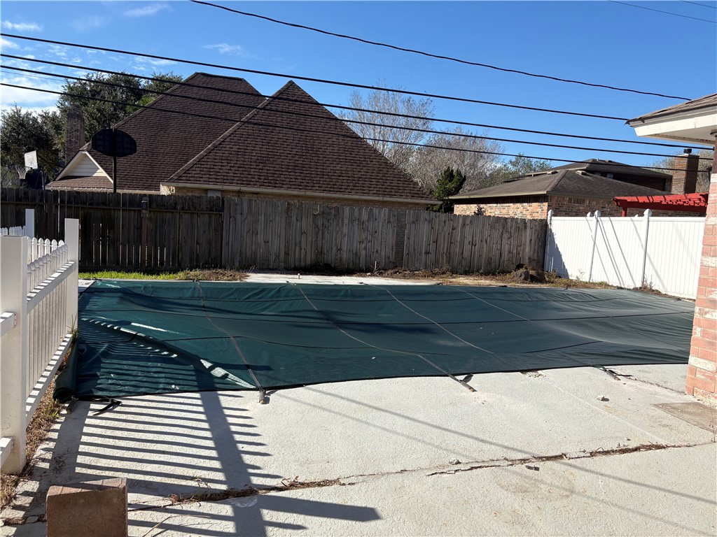 4645 Spring Fork Drive Corpus Christi, TX 78413 - Photo 6 of 7 a view of backyard with wooden fence