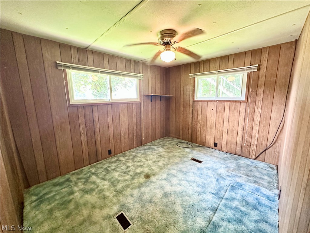 28 Richter Road Colliers, WV 26035 - Photo 14 of 38 Bedroom featuring ceiling fan and carpet flooring