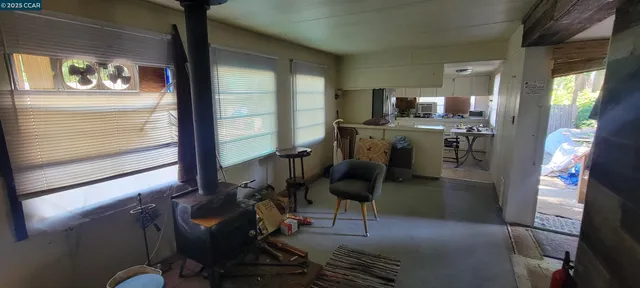 a view of workspace with wooden floor windows