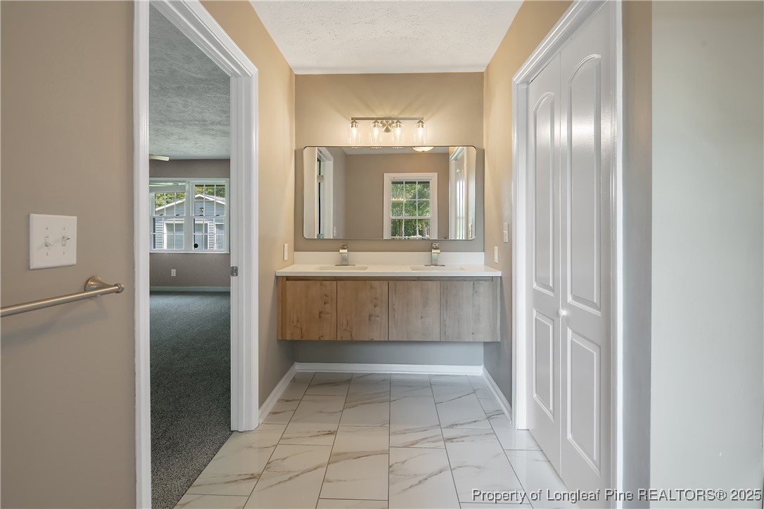 6062 Midus Street Hope Mills, NC 28348 - Photo 19 of 49 a view of kitchen with windows and refrigerator