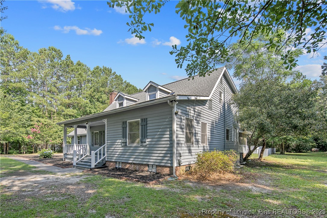 6062 Midus Street Hope Mills, NC 28348 - Photo 2 of 49 a view of a house with a yard