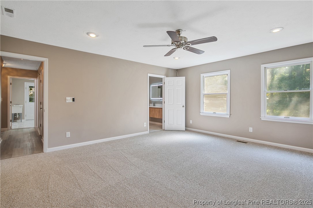 6062 Midus Street Hope Mills, NC 28348 - Photo 26 of 49 a view of a big room with windows and ceiling fan