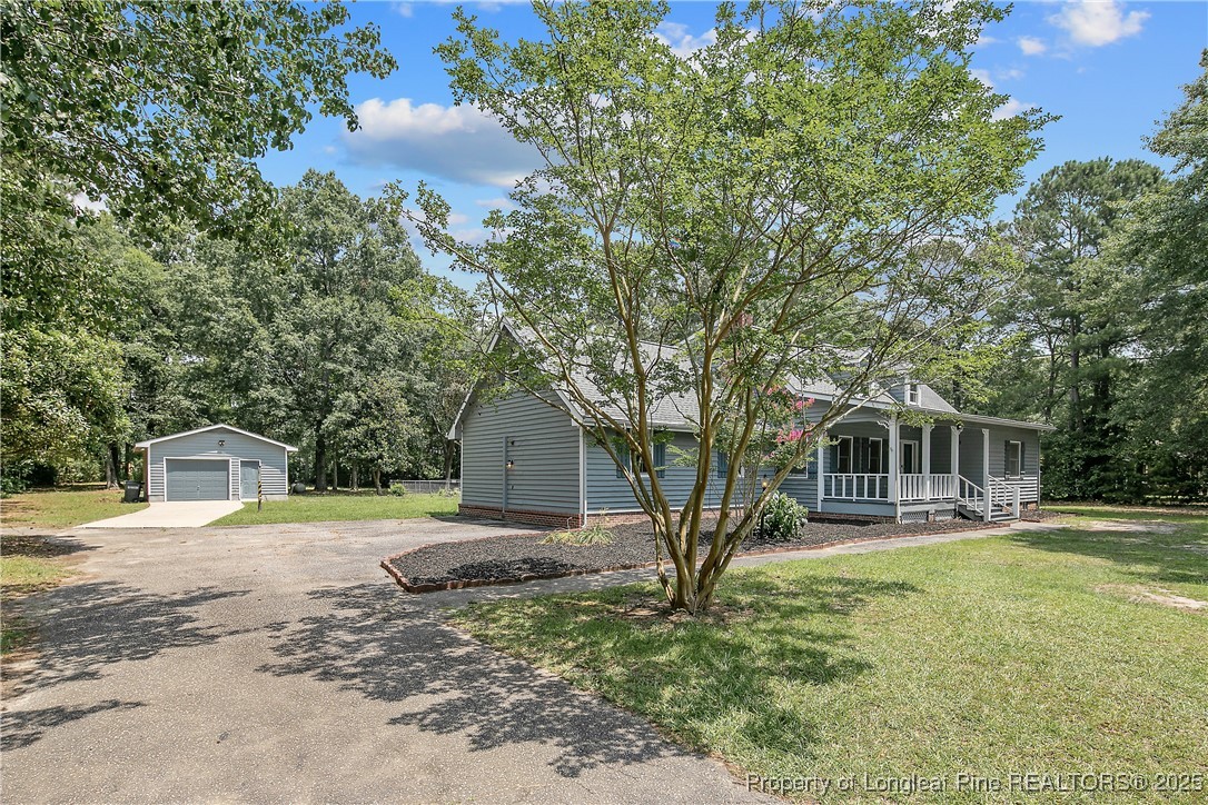 6062 Midus Street Hope Mills, NC 28348 - Photo 3 of 49 a front view of a house with a yard