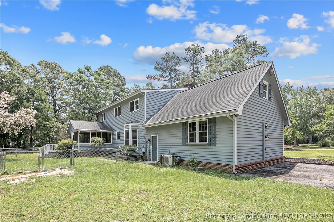 6062 Midus Street Hope Mills, NC 28348 - Photo 46 of 49 a backyard of a house with table and chairs