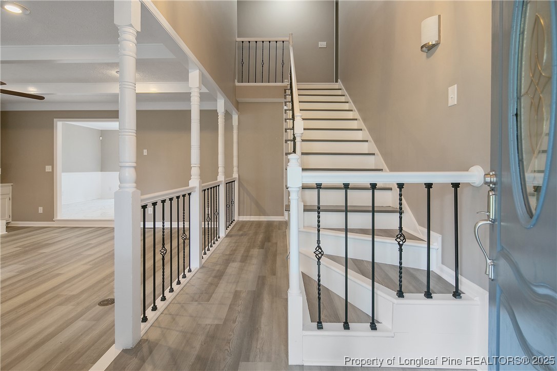 6062 Midus Street Hope Mills, NC 28348 - Photo 5 of 49 a view of staircase with railing and white walls