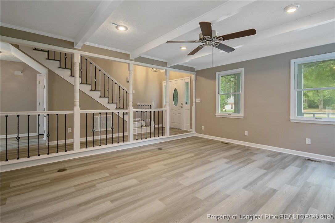 6062 Midus Street Hope Mills, NC 28348 - Photo 8 of 49 a view of an empty room with wooden floor and a window