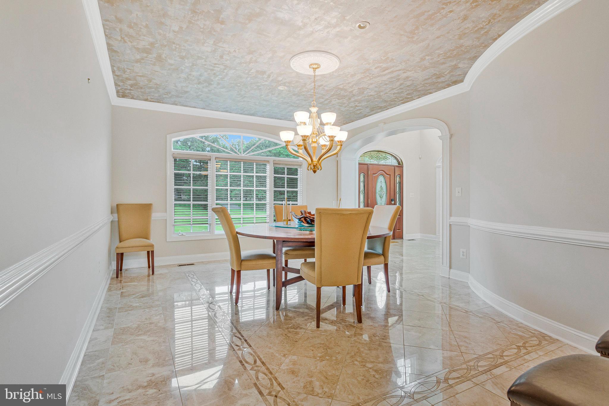 2901 George Howard Way Davidsonville, MD 21035 - Photo 11 of 70 a dining room with furniture a chandelier and wooden floor