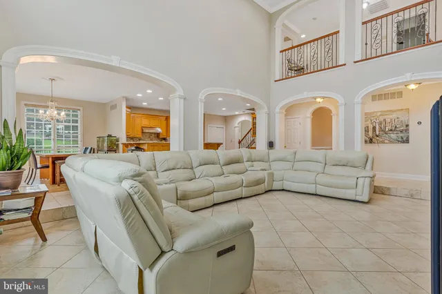 a kitchen with stainless steel appliances granite countertop a refrigerator a stove and a sink