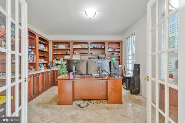 a view of a livingroom with furniture and a window
