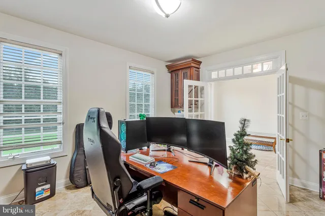 a bed room with furniture and a flat screen tv