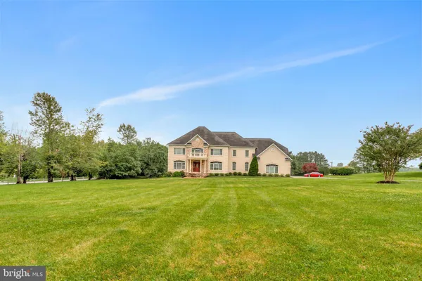 a view of a house with a big yard