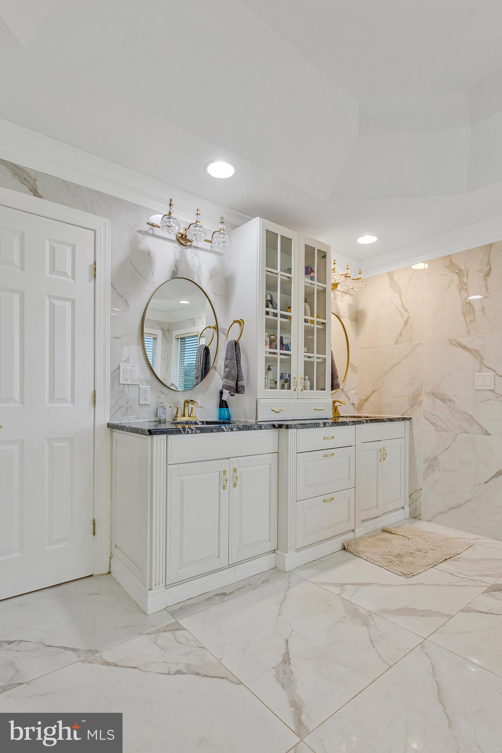 2901 George Howard Way Davidsonville, MD 21035 - Photo 35 of 70 a spacious bathroom with a granite countertop sink a mirror and vanity