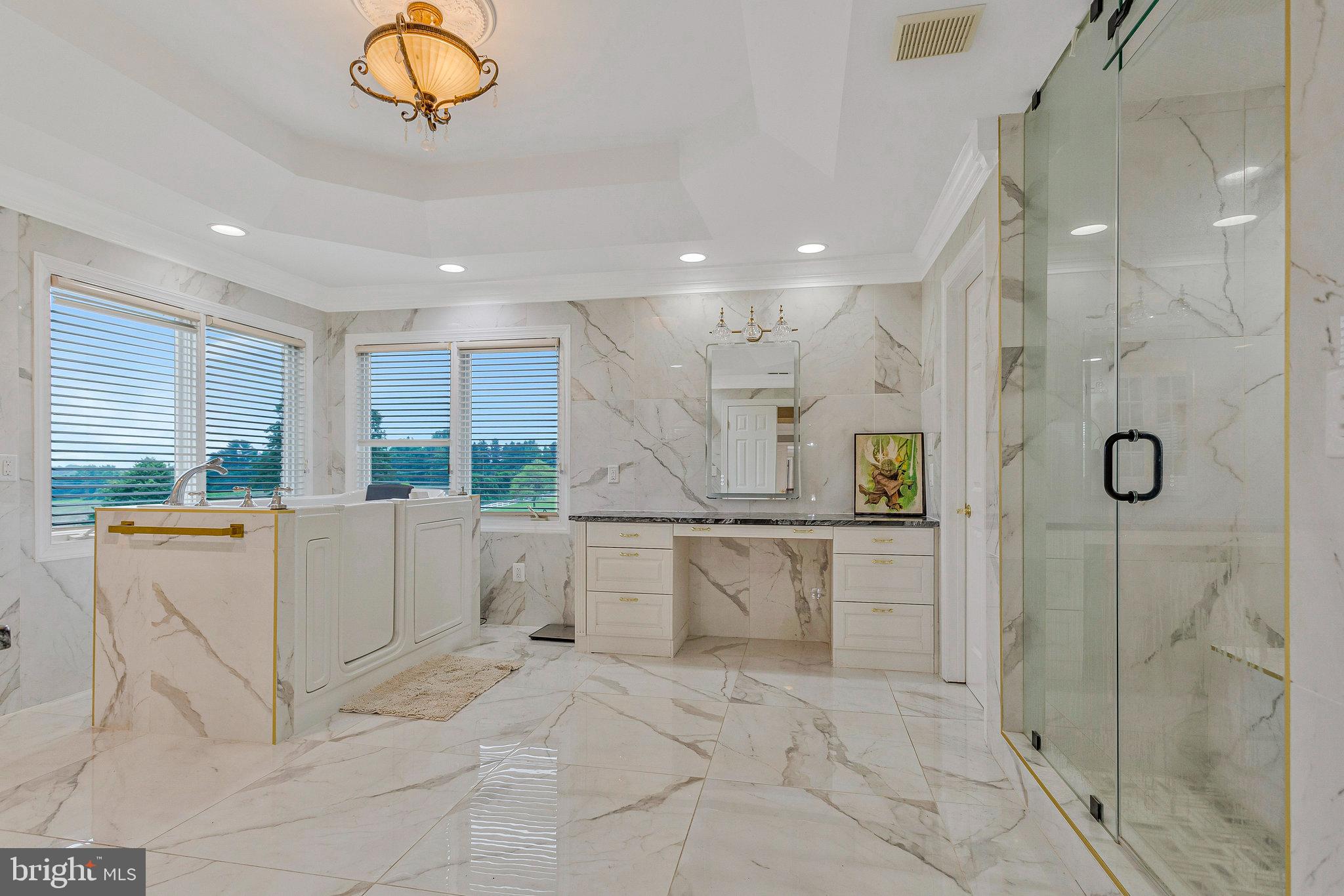 2901 George Howard Way Davidsonville, MD 21035 - Photo 39 of 70 a large white kitchen with a refrigerator a sink dishwasher a stove and white cabinets next to a window