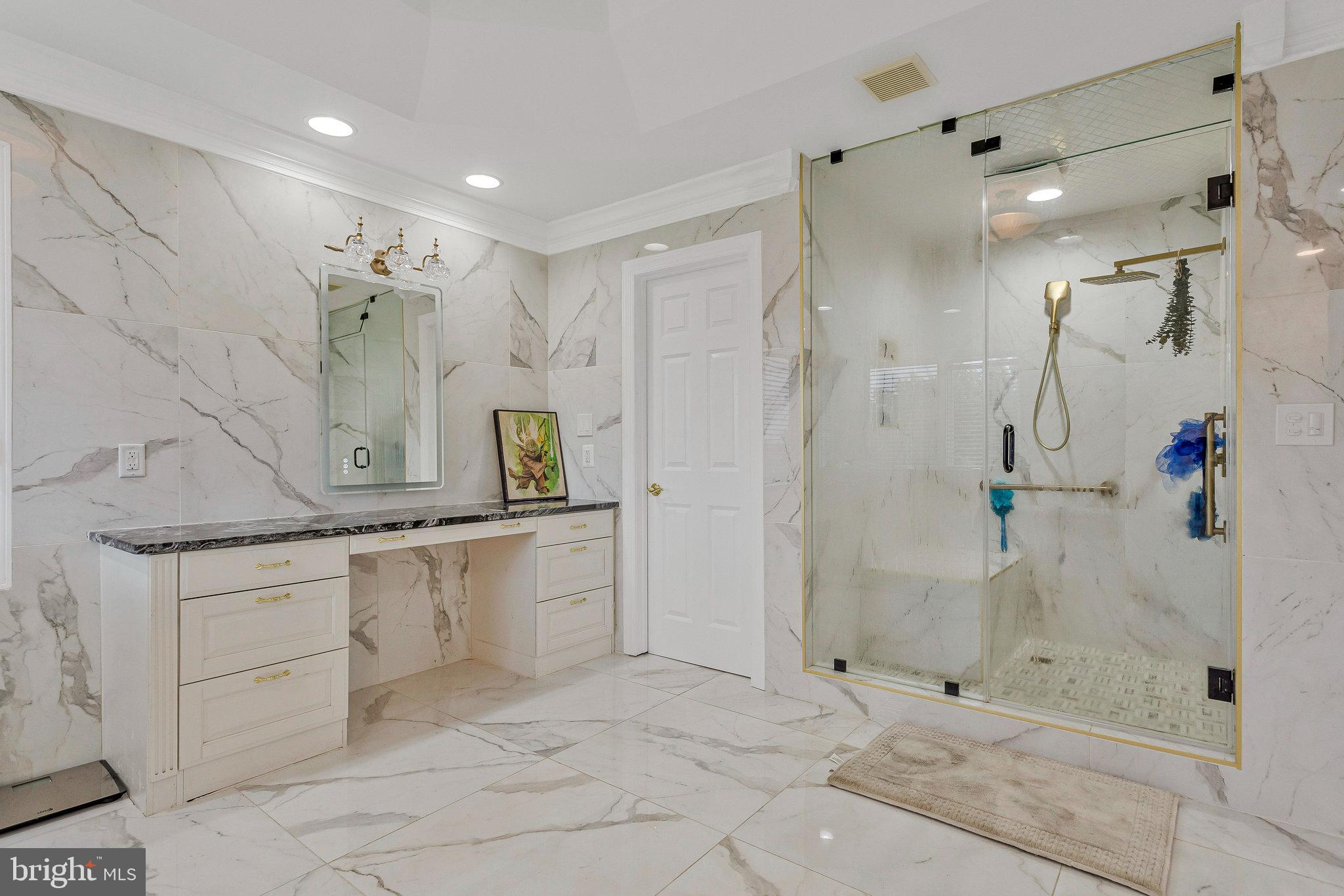 2901 George Howard Way Davidsonville, MD 21035 - Photo 40 of 70 a bathroom with a granite countertop sink mirror and shower