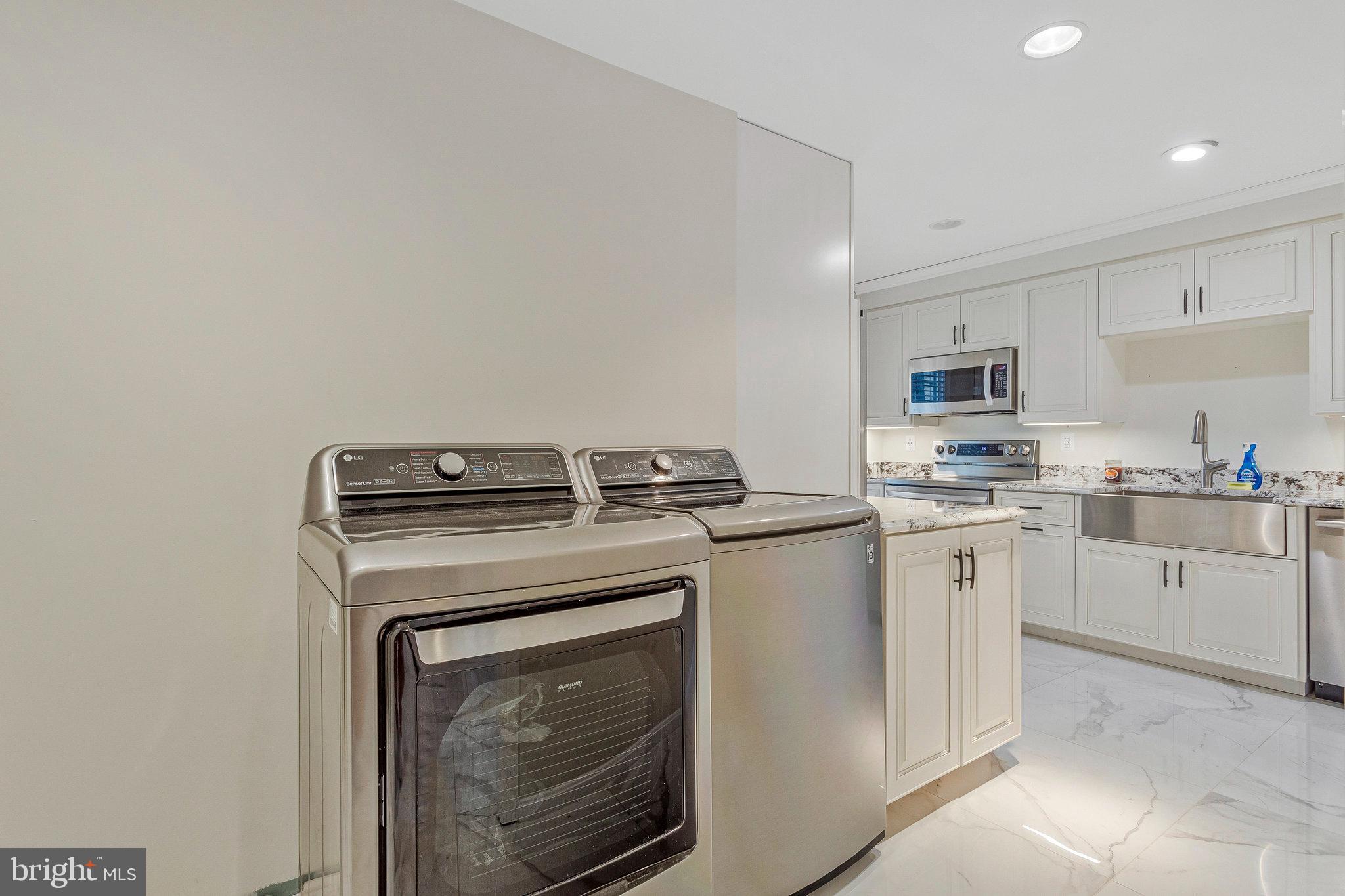 2901 George Howard Way Davidsonville, MD 21035 - Photo 43 of 70 a kitchen with a stove top oven and sink