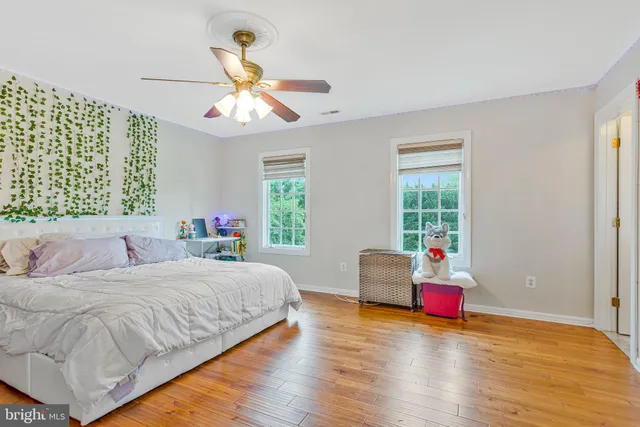 a room with furniture and wooden floor