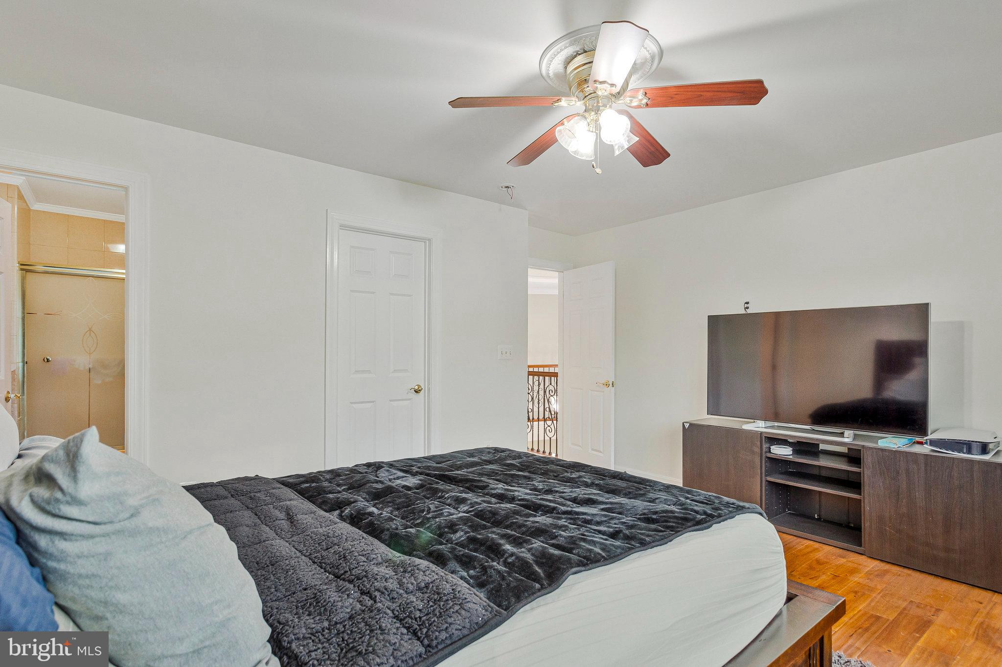 2901 George Howard Way Davidsonville, MD 21035 - Photo 53 of 70 a bedroom with a bed and a flat screen tv