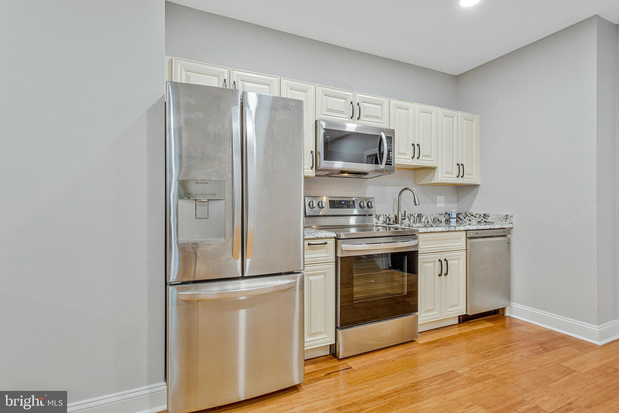 2901 George Howard Way Davidsonville, MD 21035 - Photo 61 of 70 a kitchen with stainless steel appliances a refrigerator sink and microwave