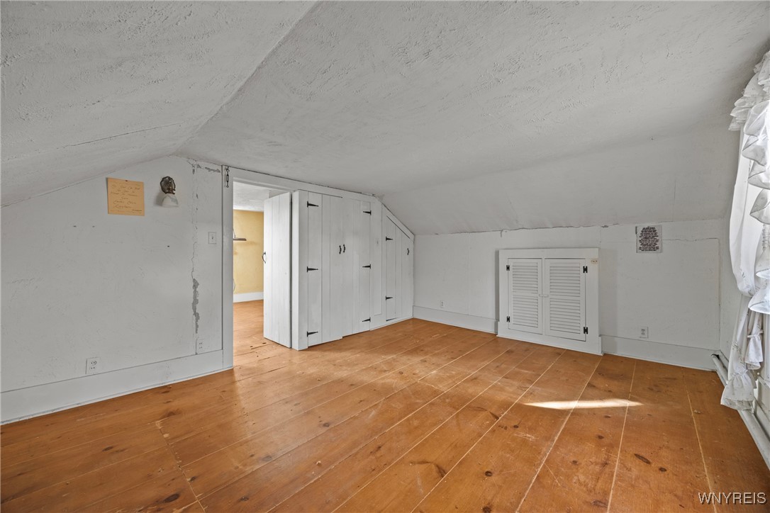 399 Lockport Street Porter, NY 14174 - Photo 35 of 50 built in storage in bedroom large plank flooring