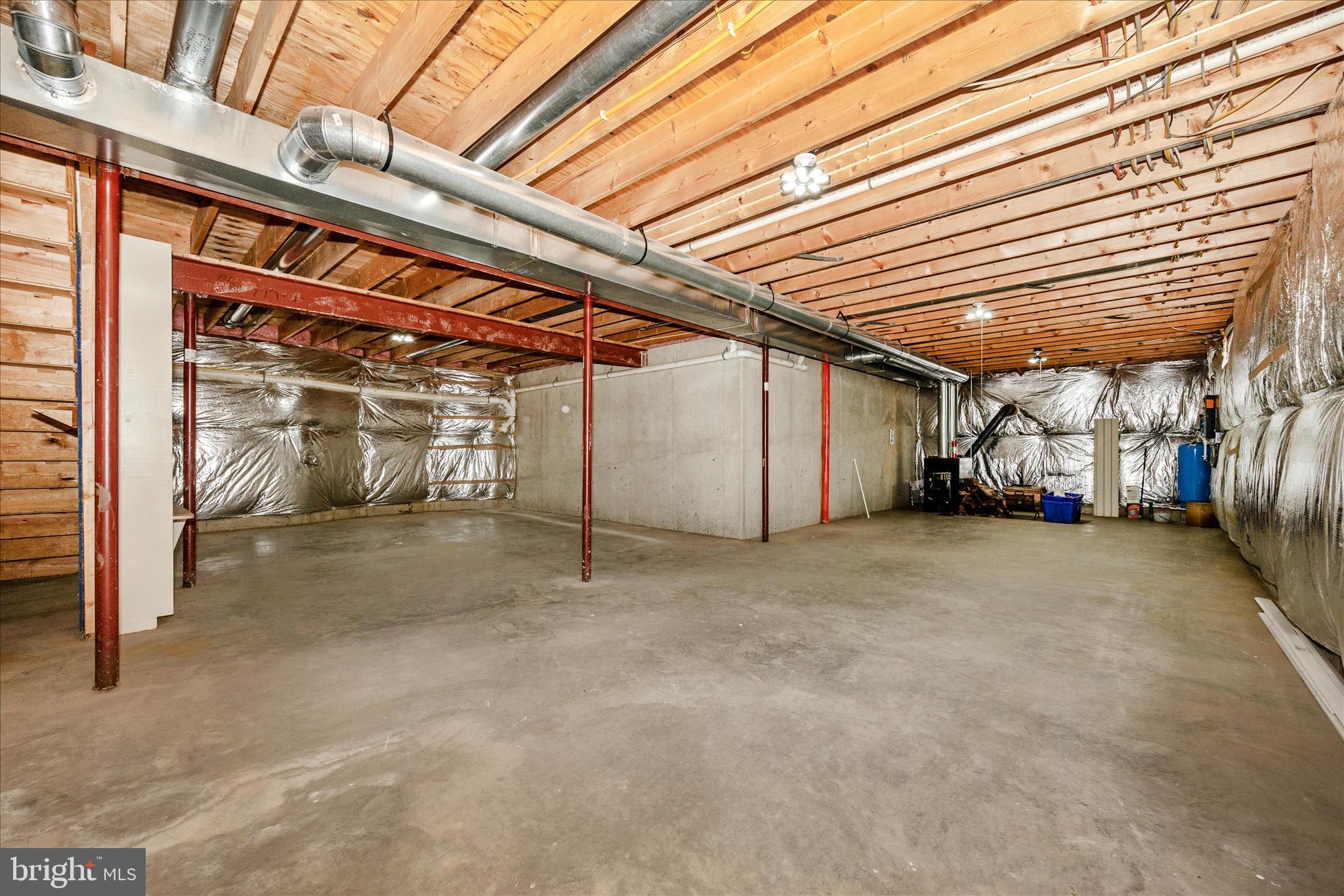 10393 Liberty Road Frederick, MD 21701 - Photo 38 of 47 Lower Level w/ 9+foot ceilings & wood furnace