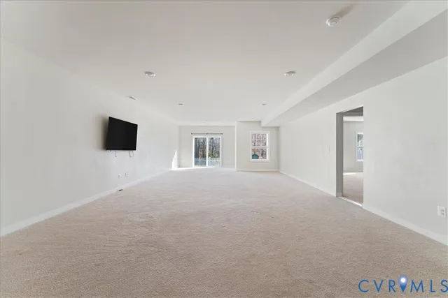 a view of livingroom with hardwood floor and flat screen tv