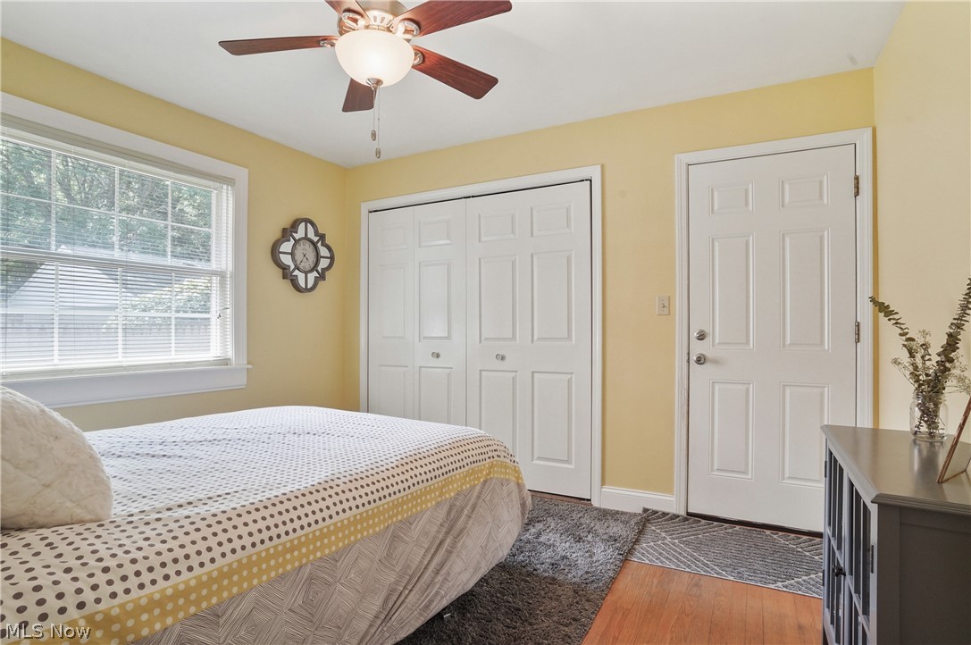 1150 Garman Road Akron, OH 44313 - Photo 23 of 38 Bedroom featuring a closet, hardwood / wood-style flooring, and ceiling fan