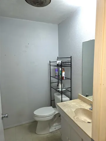 a bathroom with a toilet and a sink
