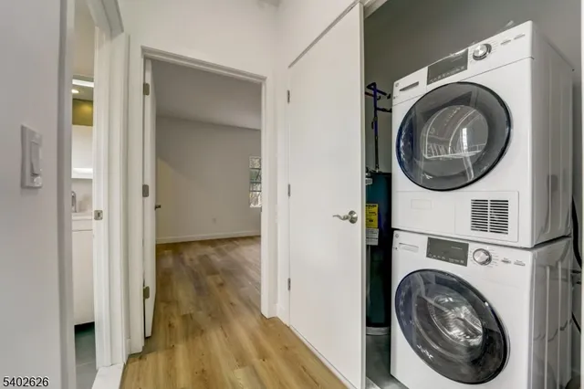 a view of a hallway with washer and dryer