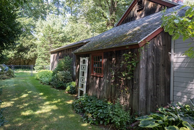 69 Fox Farms Road Northampton, MA 01062 - Photo 5 of 38 a view of a backyard with plants and large trees