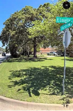 a view of a golf course with a lake view
