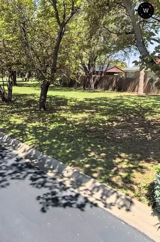 a view of outdoor space with trees all around