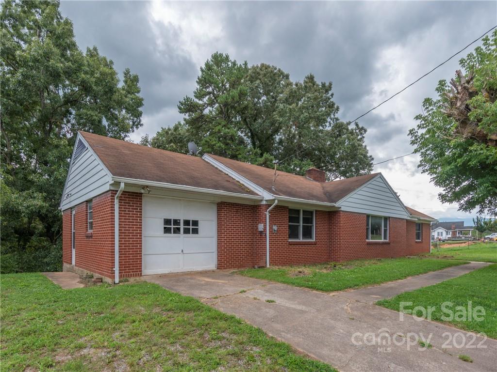 764 North Canton Road Canton, NC 28716 - Photo 2 of 16 a view of a yard in front of a house with large tree