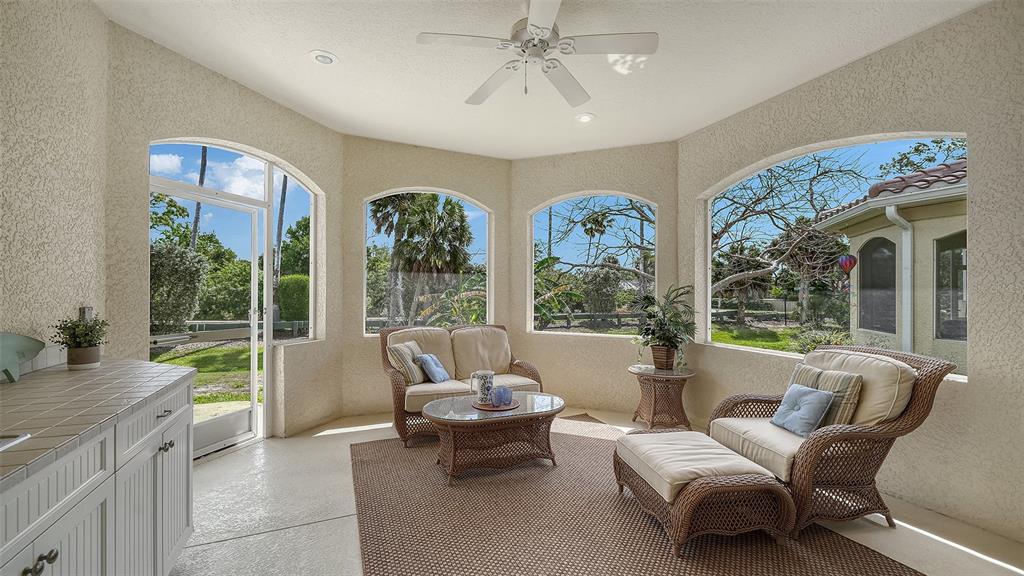 1116 Beachcomber Court, Unit 3 Osprey, FL 34229 - Photo 15 of 65 a living room with furniture and a large window