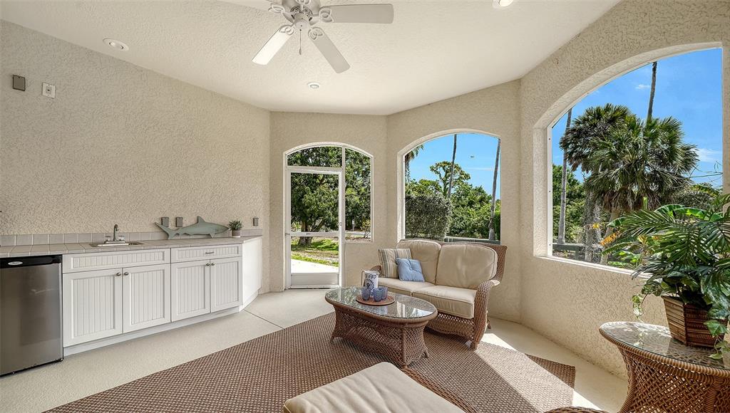 1116 Beachcomber Court, Unit 3 Osprey, FL 34229 - Photo 16 of 65 a living room with furniture and a large window