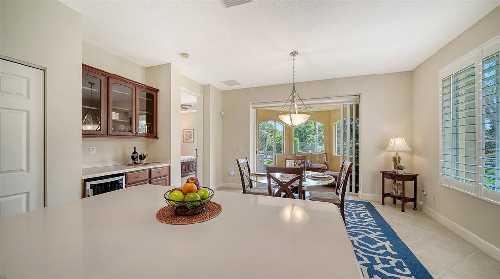 1116 Beachcomber Court, Unit 3 Osprey, FL 34229 - Photo 25 of 65 a living room with furniture and a chandelier