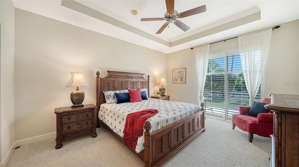 1116 Beachcomber Court, Unit 3 Osprey, FL 34229 - Photo 26 of 65 a bedroom with a bed and window