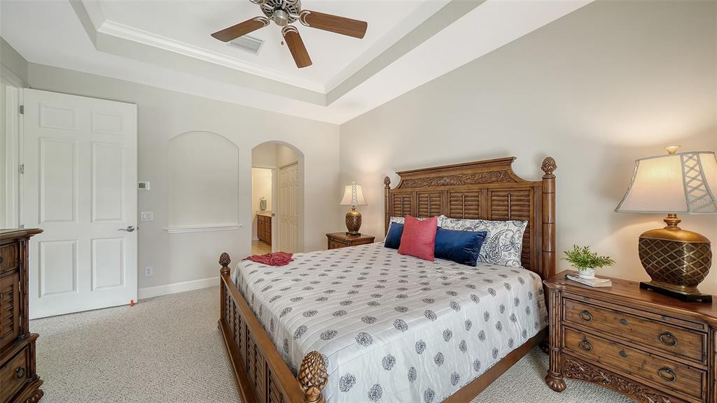 1116 Beachcomber Court, Unit 3 Osprey, FL 34229 - Photo 27 of 65 a bedroom with a bed and window