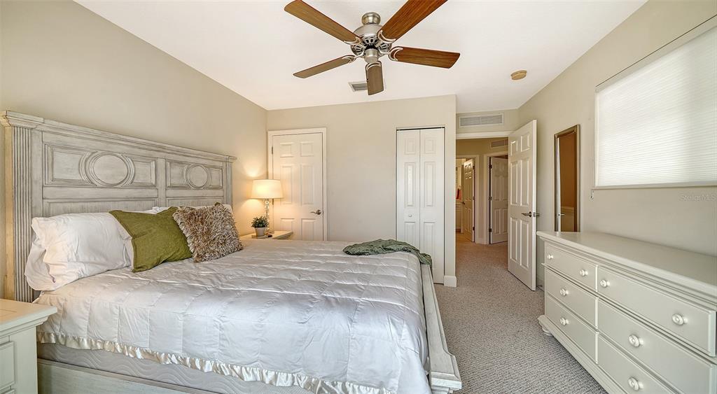 1116 Beachcomber Court, Unit 3 Osprey, FL 34229 - Photo 36 of 65 a bedroom with a bed and a window