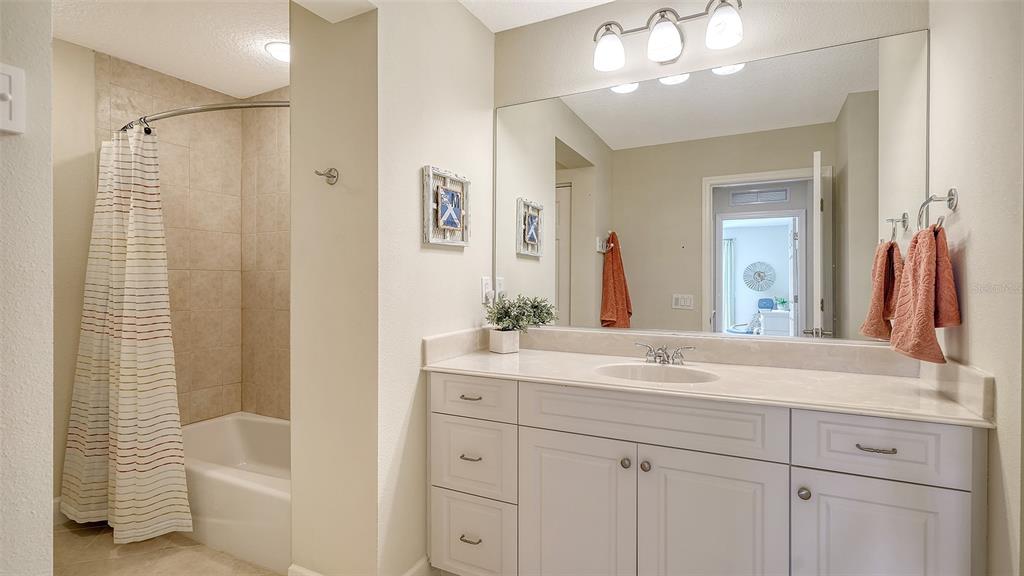 1116 Beachcomber Court, Unit 3 Osprey, FL 34229 - Photo 37 of 65 a bathroom with a sink a vanity and a mirror